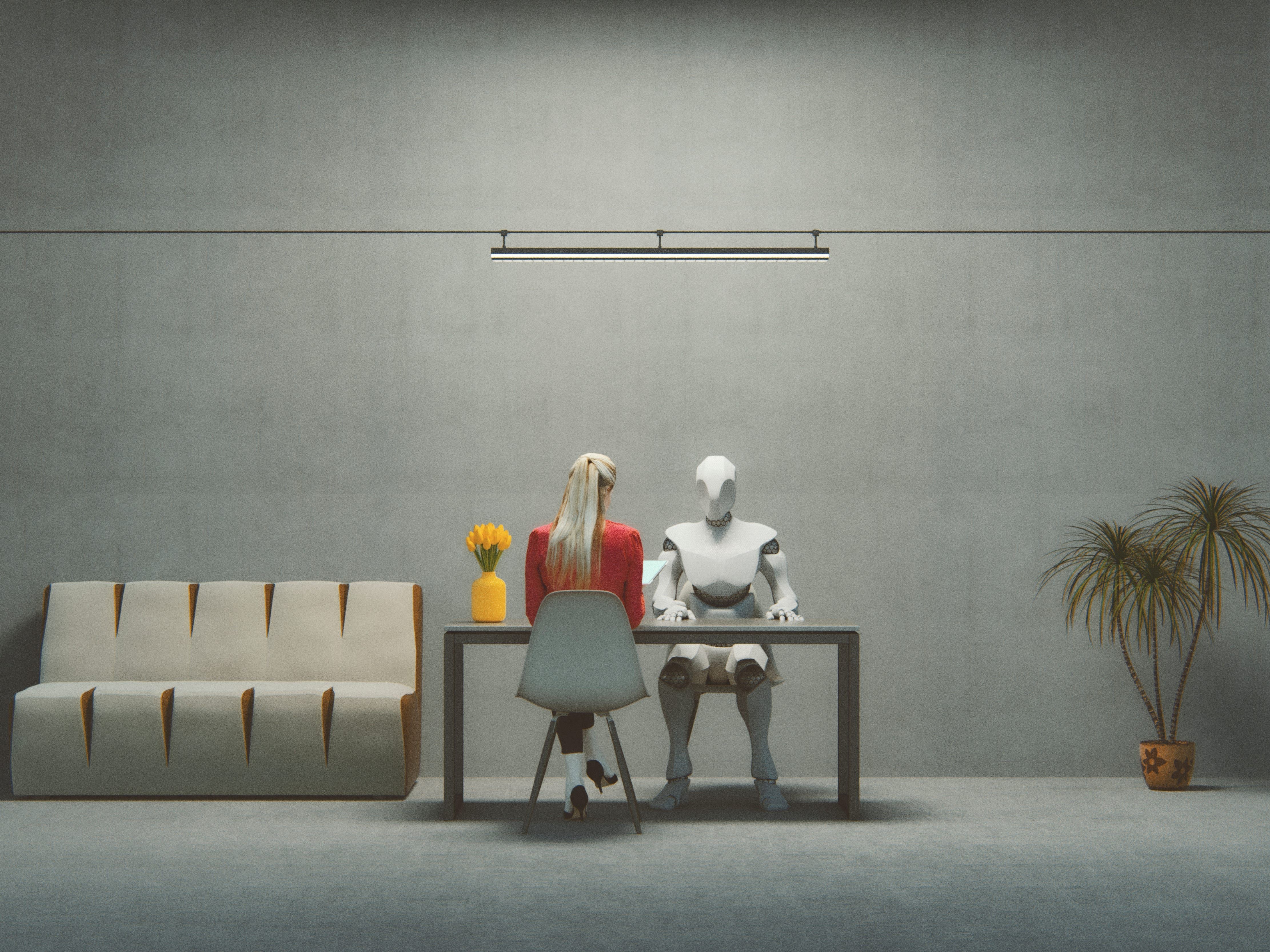 A mulher enfrenta um robô em uma entrevista de emprego, destacando os desafios dos processos seletivos com IA. Reprodução: Business Insider