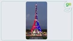 Torre Eiffel iluminada em vermelho e azul em celebração ao título da Champions League pelo PSG. Reprodução: Globo