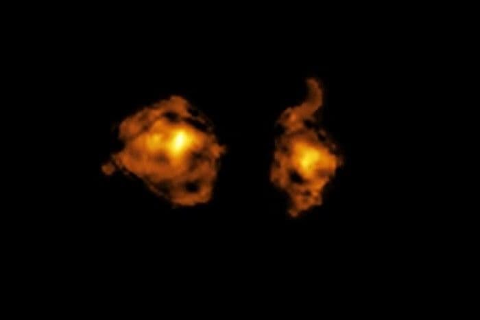 Astrônomos registram colisão de galáxias com jato de radiação alterando a formação de novas estrelas. Reprodução: Globo